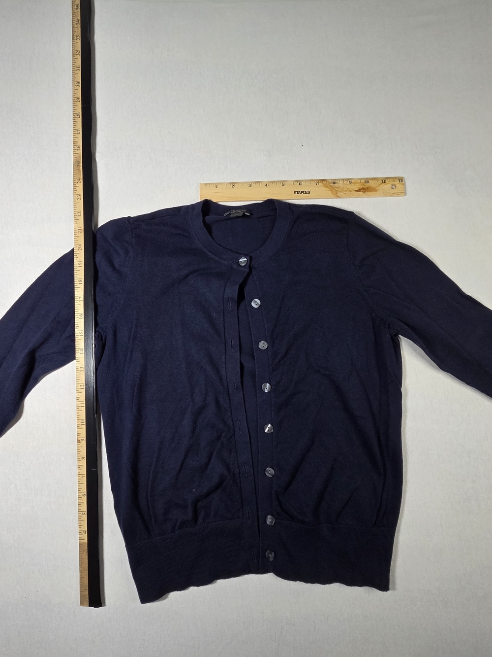Ann Taylor is a timeless navy blue crewneck cardigan sweater. Size M